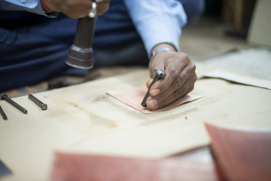 artisan hammering leather