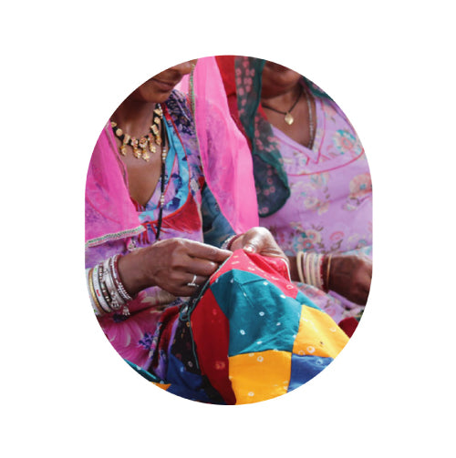 female artisan sewing sari fabric