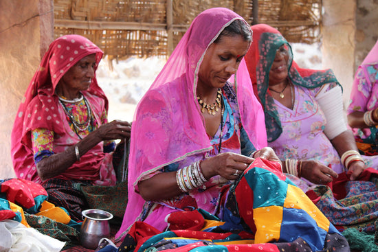 artisan sewing upcycled sari